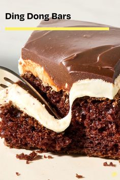 a close up of a piece of cake on a plate with a knife and fork