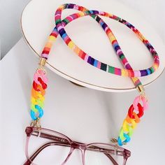 "Rainbow Sunglasses Chain Get the most beautiful compliments wearing this unique sunglasses chain. Made with cotton cord in colorful tones and a rainbow plastic chain with dainty touches of gold. This glasses chain has the versatility that you can wear it as a gorgeous bracelet. (See product images)  I T E M ~D E T A I L S Materials: Cotton cord, acrylic chain. You can also ask for a different wire color, silver or rose gold tone are available (See variations). Thank you for visiting my product. Trendy Adjustable Glasses Chains, Trendy Adjustable Glasses Chains For Party, Adjustable Multicolor Glasses Chains For Party, Multicolor Adjustable Glasses Chains For Gift, Multicolor Adjustable Glasses Chain For Party, Handmade Glasses Chains For Summer Party, Summer Festival Glasses Chains With Adjustable Chain, Adjustable Chain Glasses Chains For Summer Festivals, Multicolor Adjustable Party Glasses Chains