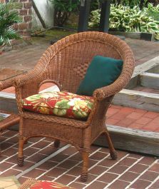 a wicker chair sitting on top of a brick patio