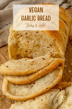 vegan garlic bread sliced and stacked on top of each other with text overlay