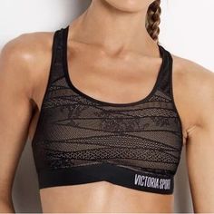 a woman wearing a black sports bra top