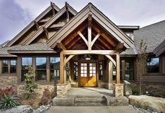 the front entrance to a home with stone steps and landscaping around it is shown in an ad for architectural designs