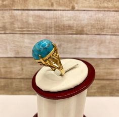 Welcome To Gold Knox Rare vintage 18K yellow gold women's ring with blue cabochon Turquoise. The stone measures 16 mm x 13 mm.Great piece with great details. Details below: Material 18k yellow gold, Turquoise Size 6 US Hallmark 18K This would make great addition to your jewelry collection. Thank you for looking PLEASE, BE SURE TO VIEW THE PICTURES CAREFULLY AND CLOSELY AS IT IS THE EXACT ITEM YOU ARE BUYING. Gold Knox Jewelry opened its storefront in Pasadena, CA in 2011, since then we do our BE Luxury Turquoise Cabochon Ring In Yellow Gold, Luxury Yellow Gold Turquoise Cabochon Ring, Gold Turquoise Oval Cabochon Ring, Yellow Gold Turquoise Ring With Polished Finish, Gold Turquoise Ring With Oval Cabochon, Anniversary Turquoise Cabochon Ring In Yellow Gold, Formal Cabochon Turquoise Ring, Light Blue Gemstone, Buying Gold