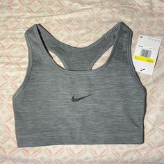 It Is Active Wear So It Is Used For Long Runs And Workouts The Color Is Grey And Can Match With Many Things. It Is New With Tags As I Am Had Bought It For Me Bad It Was The Wrong Size. Nike Gray Activewear For Workout, Nike Gray Athletic Fit Activewear, Nike Gray Sportswear Top, Nike Gray Gym Tops, Nike Gray Stretch Top, Gray Sports Bra For Light Exercise, Gray Sporty Sports Bra For Light Exercise, Nike Gray Sports Top, Gray Sports Top With Medium Support