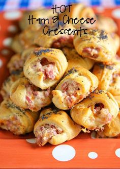 hot ham and cheese crescents on an orange plate