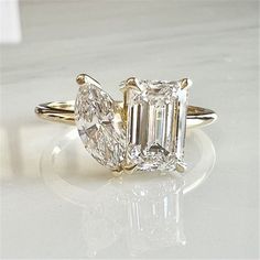 three stone diamond ring on white surface