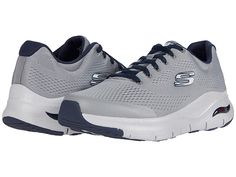 SKECHERS Arch Fit - Men's Shoes : Gray/Navy : The SKECHERS Arch Fit sneaker will enhance your outdoor style with a mixed finish design and optimal comfort features. Woven mesh fabric upper with hot-melt synthetic overlays for added structure. Lace-up design offers a secure fit. Round toe with durable reinforcement at the bumper. Padded tongue and collar. Signature logo accents at the tongue and side panel. Breathable fabric lining. Removable Arch Fit insole system with podiatrist certified arch Functional Lace-up Sneakers With Arch Support, Gray Functional Sneakers With Air Max Cushioning, High-top Synthetic Running Shoes With Arch Support, Gray Sneakers With Air Cushioning For Jogging, Gray Air-cushioned Sneakers For Jogging, Athleisure Sneakers With Engineered Mesh For Outdoor, Gray Mesh Walking Shoes For Sports, Athleisure Engineered Mesh Sneakers For Outdoor, Gray Sneakers With Air Max Cushioning For Sports