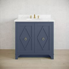 a bathroom vanity with a marble top and two doors on the side, in blue