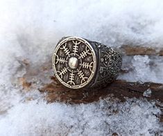 The Helm of awe or Aegishjalmur is Norse magic symbol from Poetic Edda. Helm of awe is made on Viking shield on the top of the signet ring. The ring is made to order from Italian bronze or Silver solid (without stamp). If you like Nordic, Celtic, Norse mythology or Asatru jewelry that ring will be just for you. It fits for men or women.The item shipped in wooden jewelry boxAverage weight 19 gm | 0.67 ozOther items in my shop:https://etsy.me/2YZKfPZ Shield Rings, Norse Magic, Norse Shield, Poetic Edda, Odin Jewelry, The Helm Of Awe, Nickel-free Viking Style Stainless Steel Jewelry, Norse Jewelry Norse Spirit, Nordic Jewelry