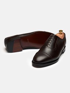 The contemporary look of The Adelaide is optimal for achieving a more simple and understated feel to your outfit. The Adelaide is crafted by hand with signature brogue punched details and U-shaped facing. It’s made on a single leather sole and is Goodyear welted, allowing for re-soling when needed. Classic Leather Oxford With Rubber Sole, Classic Leather Oxford Shoes With Rubber Sole, Leather Oxford With Rubber Sole For Semi-formal Occasion, Leather Oxford With Rubber Sole For Semi-formal Wear, Leather Oxford Shoes With Rubber Sole For Semi-formal, Classic Leather Shoes With Perforated Almond Toe, Timeless Bridle Leather Dress Shoes With Brogue Detailing, Timeless Bridle Leather Oxfords With Brogue Detailing, Classic Brown Oxford Shoes With Leather Sole