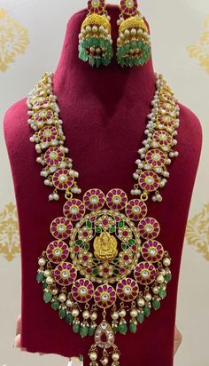 Kundanjewelsbyshiv Beautiful and adorned gold replica necklace!! Grand and ornate Gold finish premium kundan Jadau waterfall necklace. This is a very rich lotuses necklace embellished with pearls and gold danglers attached to the pumpkin beads& pearls waterfall model big pendant.. This necklace comes with adjustable dori. Indian Ethnic Kempu Kundan 22 Carat Gold Plated Necklace Set Jadau Jewelry * This Set Is made up with High Quality Jadau Kundan *  22 carat Gold Plating Is used *Length 22 inch Long Haram Gold, Waterfall Model, Pumpkin Beads, Waterfall Necklace, Long Haram, Big Pendant, Pumpkin Bead, Lotus Necklace, Jhumki Earrings