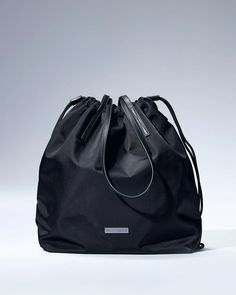 Rove Shoulder Bag - Onyx – ThirtyYears Modern Gym Bag With Removable Pouch, Functional Everyday Pouch Backpack, Everyday Functional Pouch Backpack, Modern Gym Bag With Zipper Pocket For Everyday Use, Backpack Gym Bag With Removable Pouch, Everyday Gym Backpack With Removable Pouch, Functional On-the-go Bag With Dust Bag, Pouch Drawstring, Metal Logo