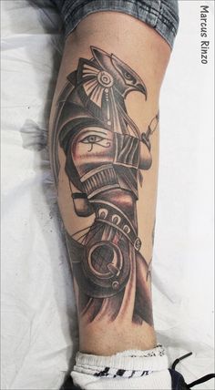 a man's leg with a tattoo on it that has an image of a ship