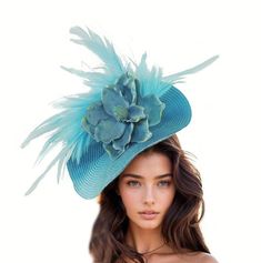 Hats By Cressida Kentucky Derby & Ascot Fascinator Hats Turquoise Blue Jeanine Flower Feather Fascinator  Gorgeous array of feathers surround a large turquoise magnolia flower set on a round soft base.  Base measures 14 inches wide Mounted with a matching headband. If you prefer a headband to match your hair, please make a note at check out what colour headband you want. Jeanine is the perfect fascinator for any formal occasion! Perfect for both Royal Ascot and Kentucky Derby races, this hat is crafted with a round soft base, adorned with a large magnolia flower and an array of feathers, making it an elegant and modern design hatinator. Whether you're the mother of the bride, wedding guest or attending a ladies day, this headpiece is sure to compliment your outfit perfectly!   This Fascina Blue Summer Fascinator Hat, Spring Blue Fascinator For Garden Party, Blue Spring Fascinator For Garden Party, Blue Adjustable Fascinator For Garden Party, Blue Fitted Fascinator For Beach, Blue Headpieces For Summer Garden Party, Blue Mini Hats For Summer Races, Blue Feather Fascinator For Kentucky Derby, Blue Feathered Fascinator For Kentucky Derby