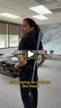 a woman standing in an office holding a pole with the words 3 ways to improve your posture