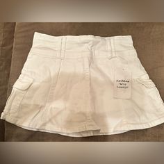 This Is A Brand New Skirt No Flaws. It States That It’s A Size Small. But It Does Run Very Small, So It Is More Like An Extra Small. Have A Cute Little Flair On The Bottom And Shorts Underneath. Super Cute. Fitted Skirted Bottoms With Pockets, Y2k High Waist Skort With Pockets, White Skirted Bottoms With Pockets, Skirted Bottoms With Pockets For Day Out, Fitted Tennis Skirt With Pockets For Spring, Spring Tennis Skirt With Pockets, Stretch Skort With Pockets For Day Out, White High Waist Y2k Mini Skirt, Spring Stretch Mini Skirt With Pockets