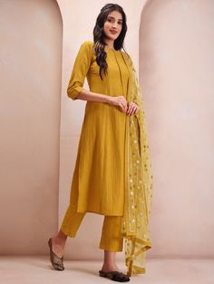 Mustard yellow & silver solid Kurta with Trousers & dupattaKurta design:SolidStraight shapeRegular styleRound neckThree-quarter regular sleevesSequinned detailCalf length with flared hemSilk blend machine weave fabricTrousers design:Solid TrousersPartially elasticated waistbandSlip-on closure Fitted Yellow Kurta With Sheer Dupatta, Yellow Palazzo Set With Straight Kurta For Eid, Yellow Palazzo Set With Straight Kurta For Diwali, Yellow Palazzo Set With Mirror Work For Eid, Yellow Kurta With Sheer Dupatta For Festive Occasions, Yellow Long Sleeve Kurta With Sheer Dupatta, Yellow Long-sleeved Kurta With Sheer Dupatta, Fitted Yellow Churidar With Sheer Dupatta, Yellow Long Sleeve Salwar Kameez With Sheer Dupatta