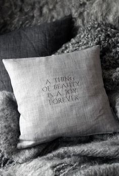 a pillow that says, a thing of beauty is a joy forever