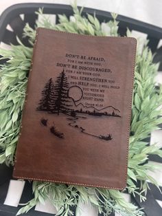 a brown leather book with the words don't be afraid on it