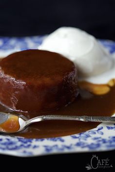 a dessert on a plate with ice cream and caramel sauce