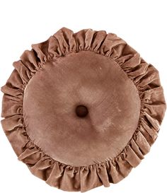 a round pillow with ruffles on it