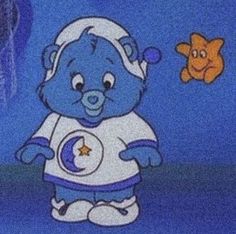 a blue teddy bear dressed in an astronaut outfit