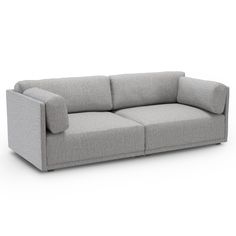 a gray couch sitting on top of a white floor