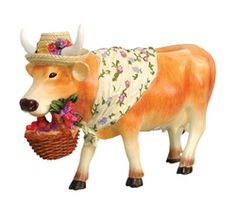 a statue of a cow wearing a hat and holding a basket with flowers on it