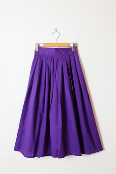 "Vintage Purple Cotton Midi Skirt from 80's. Measurements Total Length: 29 1/2\" Waist             : 23\"  Hips               : Free Condition     : Gently used. There`s no stains or holes. Good condition.  ※Please read the policy before you purchase※" Vintage Long Skirt With Relaxed Fit, Vintage Purple Lined Skirt, Retro Solid Bottoms With Lined Skirt, Vintage Long Gathered Skirt Bottoms, Vintage Long Gathered Skirt, Vintage Cotton Flared Skirt Bottoms, Vintage Cotton Flared Skirt, Vintage Cotton Midi Skirt, Vintage High Waist Relaxed Skirt Bottoms