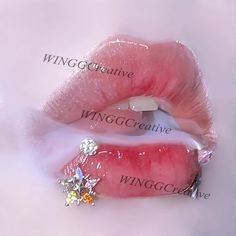 a close up of a person's lips with the word winggo creative on it