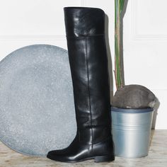 These boots combine the classical riding style with the boldness of the cuissardes. The straight leather shaft follow the leg shape without constraining. Wear them with a supple wool dress or with blazer dress for a daily casual but really bold look. Choose the calf circumference and height that best fit you, click the button above to get to know how to correctly measure your calf. Details: Fine calfskin upper Leather lining, leather insole Leather sole with a non-slip rubber insert Over-the-Kne Fitted Knee-high Boots With Leather Sole For Business, Formal Over-the-knee Boots For Fall, Fitted Moto Boots For Winter Workwear, Black Over-the-knee Calf Leather Boots, Classic Knee-high Winter Heeled Boots, Classic Knee-high Riding Boots For Fall, Fitted Knee-high Riding Boots, Fitted Knee-high Boots For Winter Business Wear, Fitted Knee-high Boots For Business In Winter