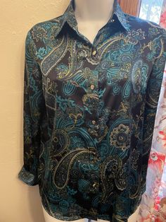 Vintage Jones New York Collection Petite Stretch paisley top. Size 4P. Excellent condition with silver buttons down the front. Long sleeved. Polyester Vintage Long Sleeve Paisley Print Top, Paisley Print Summer Top With 3/4 Sleeves, Fitted Paisley Print Button-up Top, Vintage Multicolor Paisley Print Tops, Vintage Paisley Print Button-up Top, Paisley Top, Silver Buttons, Jones New York, Womens Clothing Tops