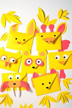 some yellow paper cut outs with faces and eyes on them, all made up of different shapes and sizes