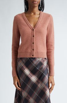 By definition, staple sweaters are worn on endless repeat which is why is makes style sense to own this cardigan knit from luxe cashmere. 20 1/2" length (size Medium) Front button closure V-neck Long sleeves Ribbed cuffs and hem 100% cashmere Dry clean or hand wash, dry flat Imported Staple Sweaters, Rose Cardigan, Cardigan Knit, Cashmere Cardigan, Vintage Rose, Vintage Roses, Knit Cardigan, Sweater Top, Cashmere