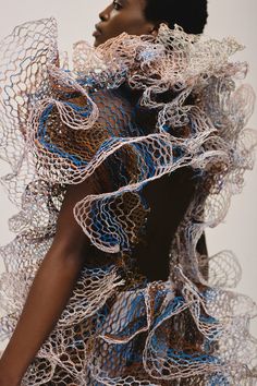 a woman in a dress made out of wire