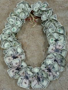 a wreath made out of dollar bills on the floor