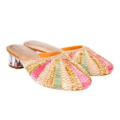 A Strip Of White Beads, Followed By Golden Sequins And Zardosi And Then One Of Either Pink Or Green Sallis Converging At The Centre To Resemble The Rays Of The Sun. These Rose Gold Mules Have Almost A Flower Shaped Transparent Heel With A Broad Base For Extra Comfort. This Pair Like Its Name Kiran Is Bound To Emit Radiance To Your Look. Suitable For- Dinners, Lunches, Casual Meetings, Festivals, And Semi-Formal Occasions Heel Size - 2 Inches Heel Type - Transparent Block Material - Silk,Wood,Pvc Multicolor Embellished Open Toe Heels, Beaded Heels For Formal Summer Events, Summer Formal Beaded Heels, Elegant Embellished Multicolor Sandals, Elegant Multicolor Embellished Sandals, Multicolor Embellished Evening Sandals, Embellished Multicolor Evening Sandals, Traditional Multicolor Heels For Spring, Evening Multicolor Embellished Sandals