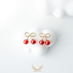 These charming bow cherry earrings are made of 925 sterling silver and feature delicate gold plating with red agate accents. The playful design, combining a cute bow with dangling cherries, adds a whimsical touch to any outfit. Perfect for adding a pop of color and fun,  This wonderful piece of jewelry will make a sweet, thoughtful, and precious gift for yourself or that special someone. Material: 925 Sterling Sliver/Red agate *Finishing: Gold plated *Size:13mm X12mm *Weight: 1.0g *Lead & Nickel free, hypoallergenic As with all delicate jewelry, they need love and care to maintain  their beauty for a long time. We recommend:   -Remove before showering or other water activities to  minimize contact with moisture or chemicals  -Avoid exposure to liquids and cosmetics -Do not wear while sleep Elegant Cherry Colored Jewelry For Party, Cherry Colored Jewelry For Valentine's Day Party, Cherry-colored Jewelry For Valentine's Day Party, Cherry Color Jewelry For Valentine's Day Party, Cherry Jewelry For Valentine's Day Party, Elegant Cherry Drop Earrings, Cherry Colored Earrings Gift, Cherry Colored Earrings For Valentine's Day Gift, Cherry Earrings For Valentine's Day Gift