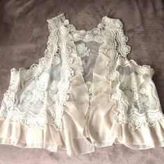 Nwt Sheer Lace Umgee Vest. Super Cute Over A Dress Or With A Top & Pants. Sizes Small/Medium Or Medium/Large White Feminine Camisole With Lace Patchwork, Lace Sleeveless Vest Top, Feminine Cream Lace Top With Patchwork, Feminine Beige Lace Top With Lace Patchwork, Beige Sleeveless Lace Top With Lace Trim, Lace Pants Outfit, Lacey Blouse, Flowy Mini Skirt, Dark Wash Denim Jacket