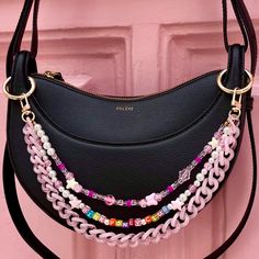 👜 Do you also want to make your bag unique? 👜 I offer you chains and accessories with tailor-made lengths to hang on your bag using an ultra-simple ring system that works with the majority of bags ✌️ It's the ideal accessory to transform your bag into jewelry, and give it that little something extra for a 100% trendy look. ❣️Is this your first Lodzé bag chain? ❣️ Don't forget to select the clip rings (+7€) for the bag so you can hang your chain on your bag 👜 * The PINK PONY CLUB 🦄 chain trio is perfect for bringing out the queen in you! * ⚠️ Please note: this is a bag charm and not a shoulder strap! ❣️Do you want a custom length? ❣️ Go to the personalization area For the chain to perfectly match your bag it is necessary to give me the space between the handles of the bag (or between th Pink Bags With Chain Strap As Gift, Handmade Pink Bag For Personal Use, Pink Bags With Chain Strap For Gifts, Pink Chain Bag For Gift, Pink Shoulder Bag With Chain Strap For Gift, Pink Bag With Chain Strap As Gift, Pink Shoulder Bag With Chain Strap As Gift, Handbag Charms Aesthetic, Purse With Charms Aesthetic