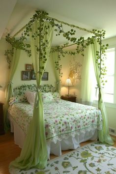 a green canopy bed with flowers on it