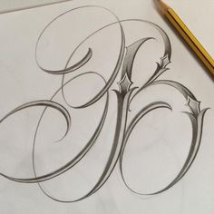 the letter g is drawn on paper with pencils