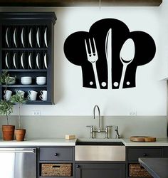 a kitchen wall decal with utensils and spoons