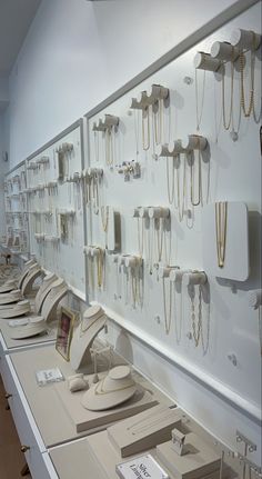 there are many necklaces on display in the store