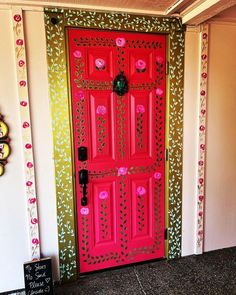 a red door with pink flowers painted on it