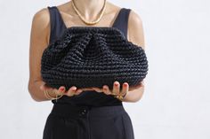 "BLACK Metallic Raffia Bag, Raffia Cloud Clutch, Raffia Bag, HandBag Crochet Clutch, Hand Knit Clutch, Evening Clutch, Raffia Clutch All pictures are Medium Size A leather clutch is an essential accessory, whether you prefer a pouch, fold-over, or drawstring design. In particular, one with clean lines or matted tone hardware is ideal for transitioning from day to night, with casual and elegant attire. One piece is ready for shipping Black Color Metallic effect, Leather  Yarn Lining Turkish Satin Knit Clutch, Black Clutch Purse, Handbag Crochet, Raffia Clutch, Clutch Purse Black, Cloud Bag, Xmas List, Crochet Clutch, Elegant Attire