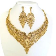 Champagne Gold Necklace And Earring Set Rhinestone Crystals Formal Statement Jewelry Set! - Perfect For Weddings/Bridal Events, Bridesmaids, Prom, Formal Evening Dress Party, Holidays, Or Any Special Occasions! - Made Of Rhinestones, Crystals And Alloy. - Adjustable Necklace 20"Inch Round, Light Weight Earrings L:2.9", W 1.2"Inches. - Hypoallergenic Lead And Nickel Free. - Closure For Pierced Ears. - We Pack In A Beautiful Jewelry Box, Ideal Gift! Thank You! X Gold Necklace And Earring Set Champ Prom Necklace Gold, Prom Necklace, Gold Jewelry Prom, Prom Necklaces, Bridal Events, Gold Prom, Prom Inspo, Gold Bridal Jewellery Sets, Bridal Jewelry Set