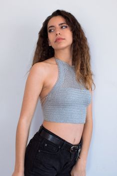 This hand knit halter tank top - bralette is the perfect outfit for festival goer, beachwear and summer days. If you want to be unique in your boho chic style, then choose this halter top. This crochet crop top has an adjustable halter design, adjustable ties on neck and back. COLORS: Here shown in Gray and also available in Black. (Please note that light effect, monitor's brightness, contrast etc. may cause a slight color difference) SIZE: The measurement table is at the end of the photos. If y Fitted Knit Halter Neck Tank Top, Stretch Knit Halter Neck Crop Top, Seamless Racerback Tank Top For Beach, Fitted Halter Neck Tank Top For Beach Season, Fitted Knit Halter Top, Seamless Sleeveless Halter Top For Vacation, Beach Knit Fitted Halter Top, Beach Fitted Knit Halter Top, Seamless Crochet Top For Summer Vacation