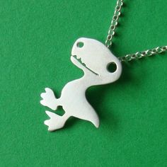 "Sterling silver dinosaur necklace, T-rex pendant. The dinosaur is 2,7cm/1,1\" tall and 2,3cm/0,9\" wide. Available in sterling silver, yellow gold plated sterling silver, rose gold plated sterling silver. Chain options: 40 cm / 16 inches or 45cm / 18 inches, available in sterling silver, yellow gold plated sterling silver, rose gold plated sterling silver, or no chain. Also available as stud earrings and tiny pendant: https://www.etsy.com/listing/76823993 https://www.etsy.com/listing/75009117 S Nickel-free Novelty Pendant Necklaces, Nickel-free Novelty Pendant Necklace, Novelty Nickel-free Pendant Necklace, Silver Novelty Necklace For Gift, Themed Sterling Silver Nickel Free Necklaces, Personalized Themed Sterling Silver Necklace, Themed Sterling Silver Nickel-free Necklace, Novelty Necklace With Lobster Clasp For Gift, Themed Silver Necklace For Birthday