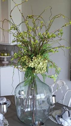 a vase filled with flowers sitting on top of a table